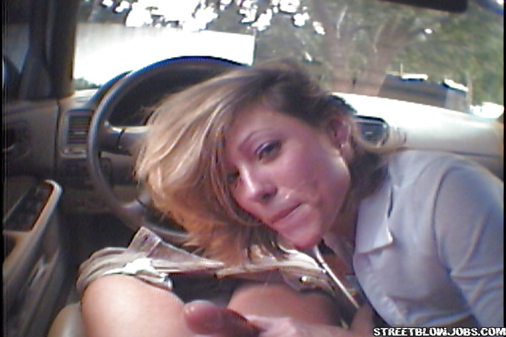 Sweet babe is sucking big penis with pleasure in the car