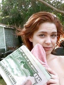 Lustful man is offering this young redhead chick to fuck with him outdoor. He is giving her cash and drilling her sweet holes on the green grass.